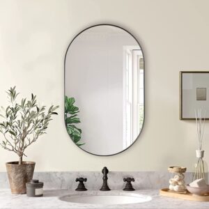 Black metal framed oval wall mirror, modern minimalist vanity mirror for bathroom and entryway decor