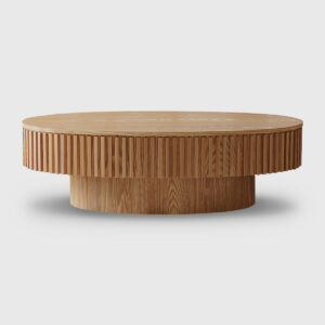 Modern oval storage coffee table with ribbed wood finish and lift top, placed in a cozy contemporary living room with boucle sofa