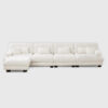 White cloud modular sectional sofa with plush cushions, large L-shaped upholstered sofa in bright modern living room