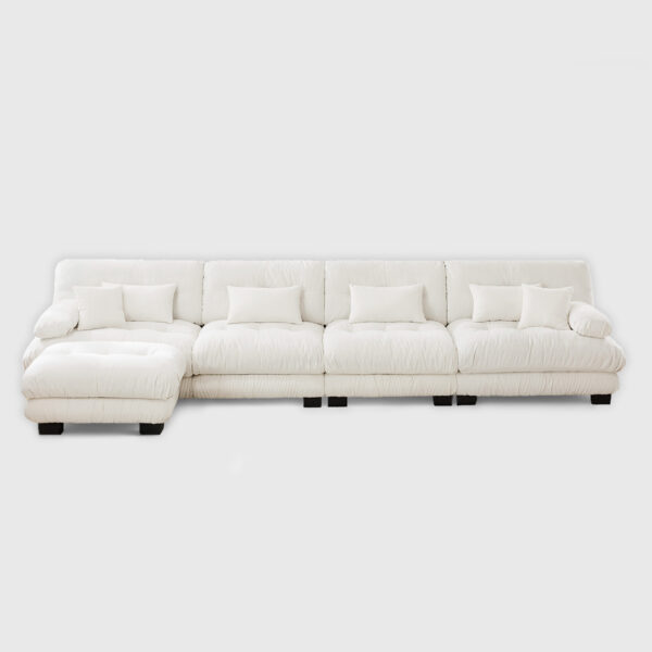 White cloud modular sectional sofa with plush cushions, large L-shaped upholstered sofa in bright modern living room