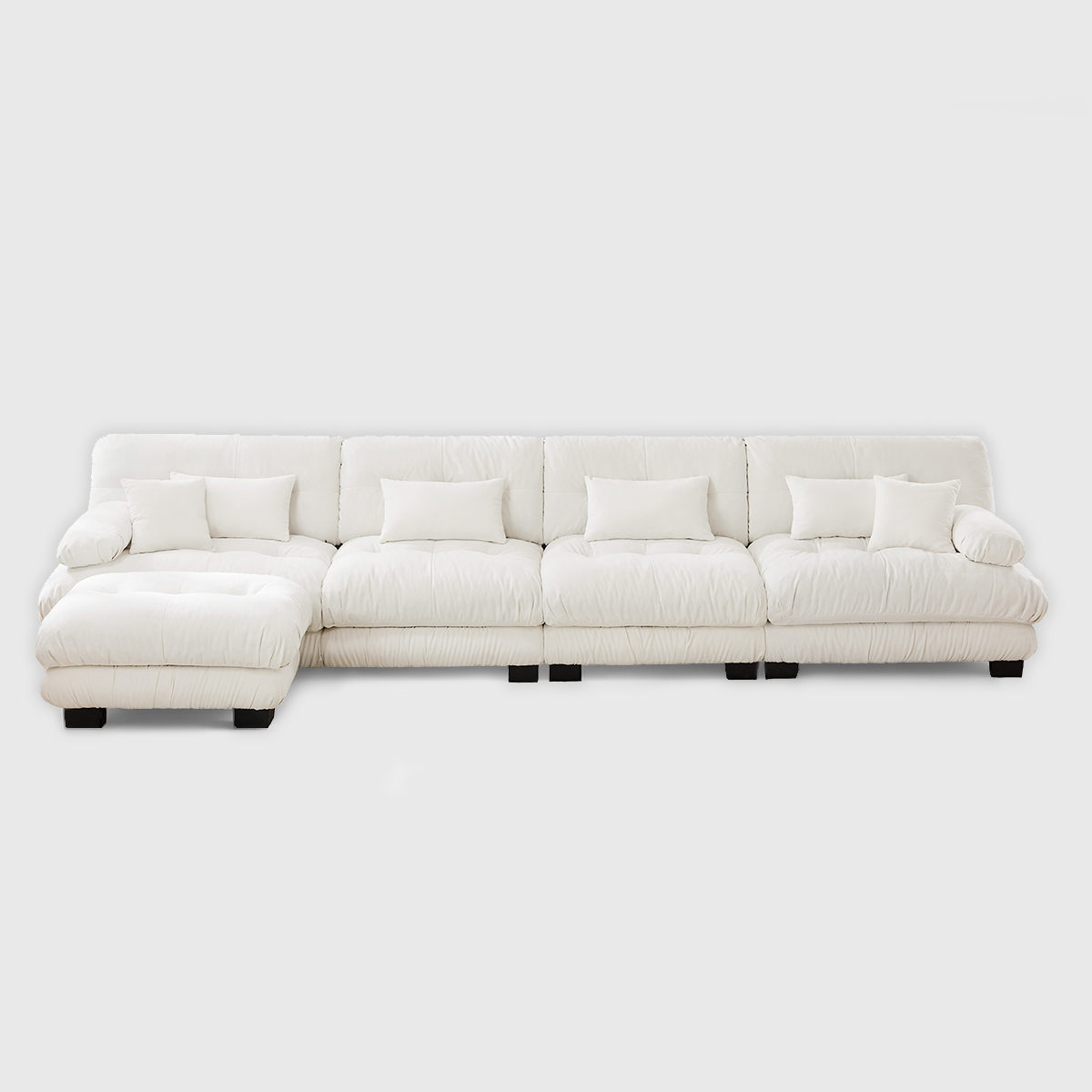 White cloud modular sectional sofa with plush cushions, large L-shaped upholstered sofa in bright modern living room