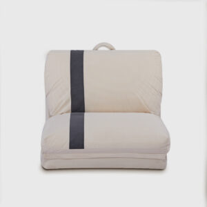 Adjustable beige floor sofa chair with foldable design, positioned as a chaise lounge in a modern minimalist living room