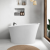 Matte white solid surface freestanding deep soak bathtub with seat and headrest in modern bathroom