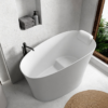 Matte white freestanding solid surface bathtub with seat and headrest in bathroom