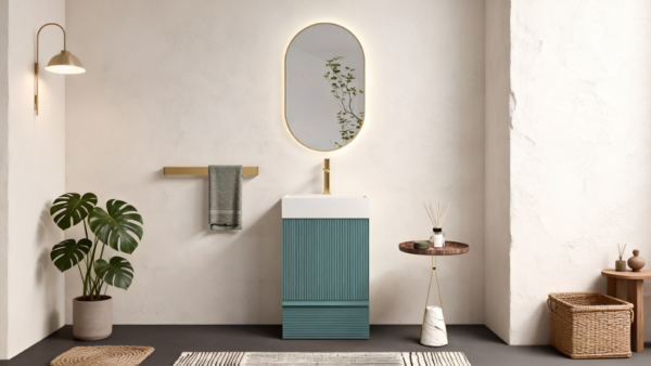 Modern teal fluted narrow freestanding bathroom vanity with brass faucet in small boho bathroom